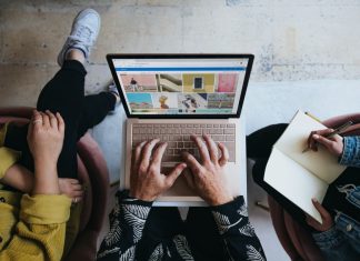 Why Digital Marketing is Essential for Startups? People working on a laptop to create a digital marketing campaign.